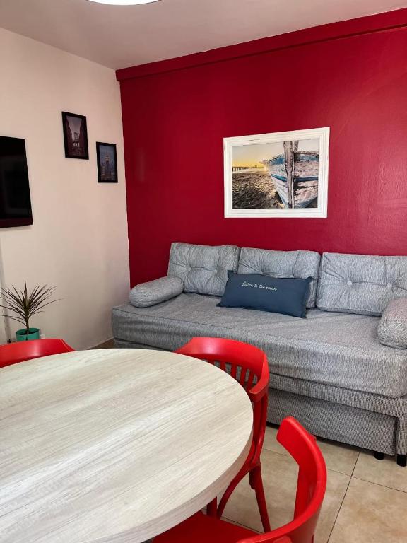 a living room with a couch and a table at DEPARTAMENTO MIRAMAR in Miramar