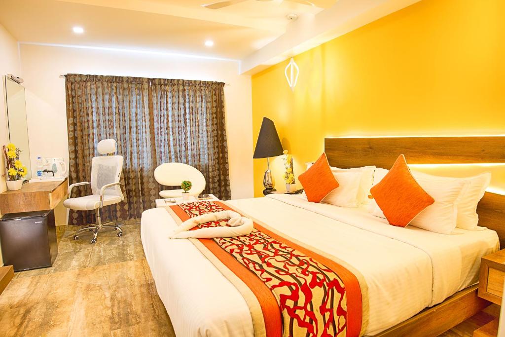 Postel nebo postele na pokoji v ubytování Hotel Chenthur Park