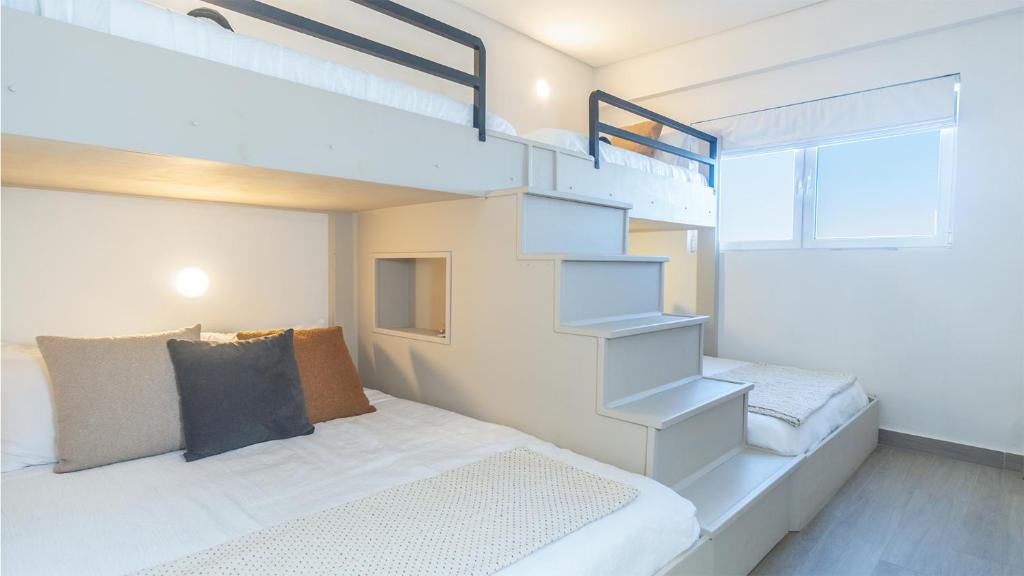 Ένα ή περισσότερα κρεβάτια σε δωμάτιο στο Encantame Towers Viento 901