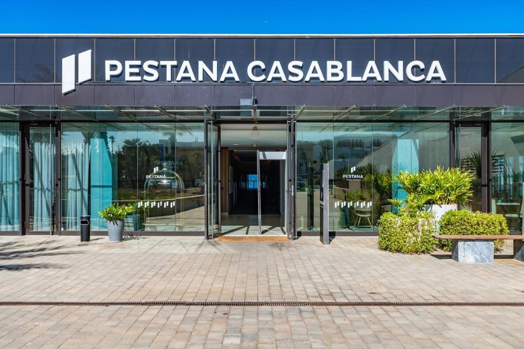 a building with a sign on the side of it at C07- Pestana - Luxury Hotel Flat - Terrace - Pool in Casablanca