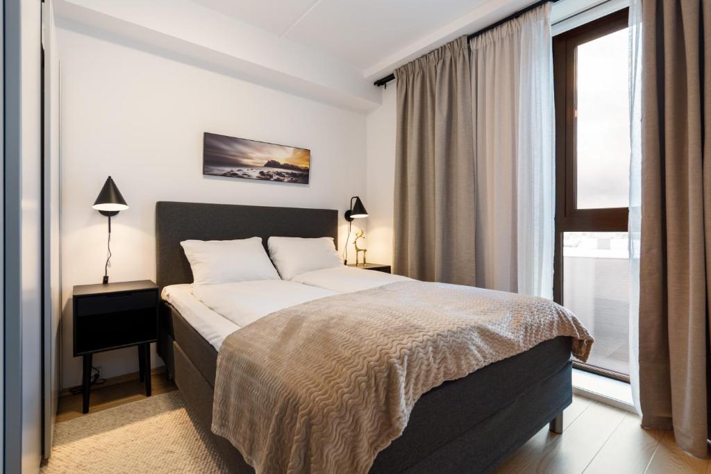 Ένα ή περισσότερα κρεβάτια σε δωμάτιο στο Aurora City Center Suite - City & Mountain View