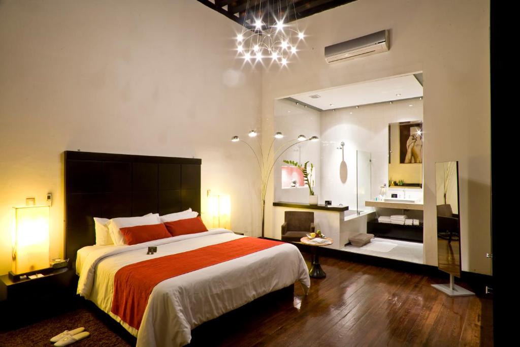 Postel nebo postele na pokoji v ubytování Cantera 10 Hotel Boutique