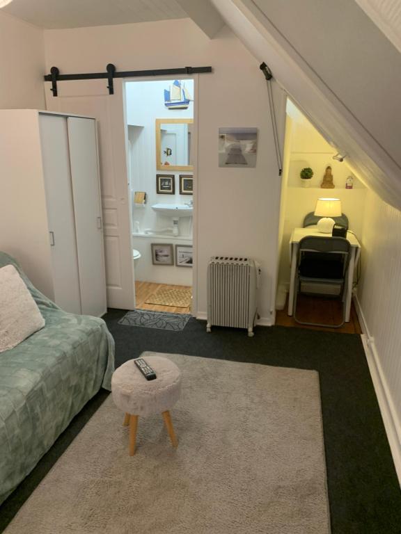 a bedroom with a bed and a room with a bathroom at 45 Grande Rue bis in Ault