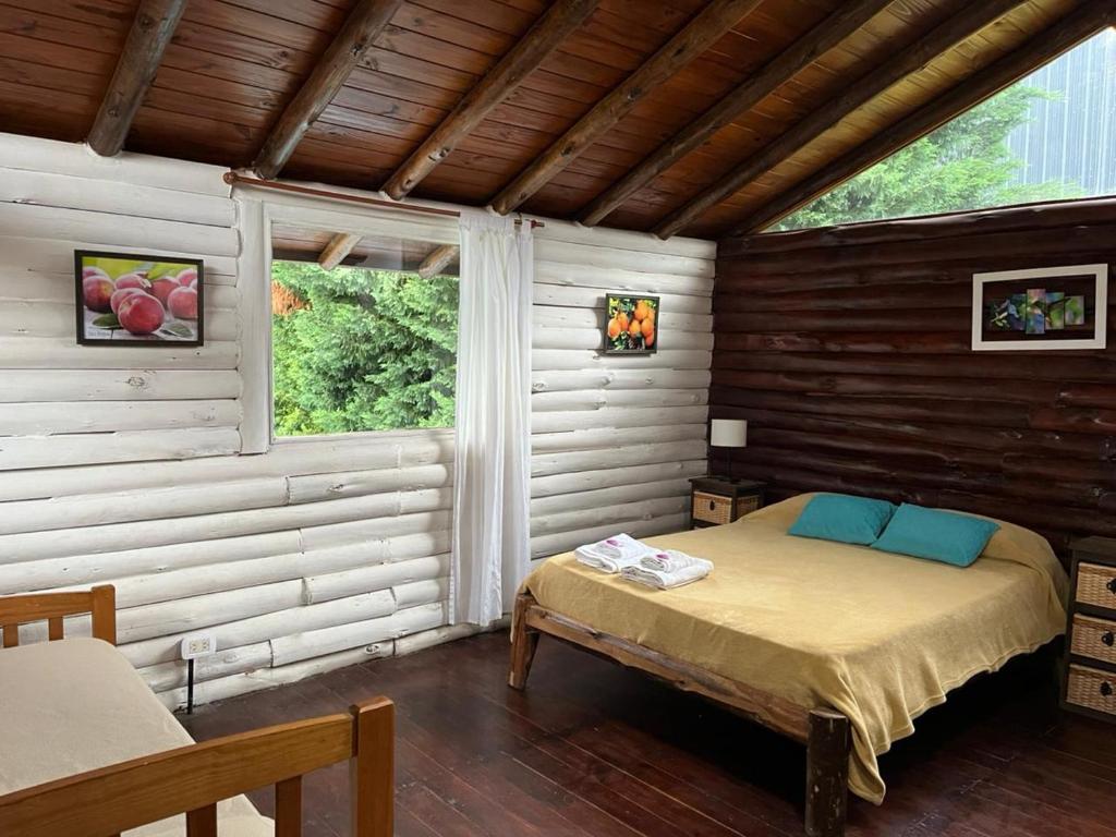 Postel nebo postele na pokoji v ubytování El Durazno Apart Hotel y Cabañas