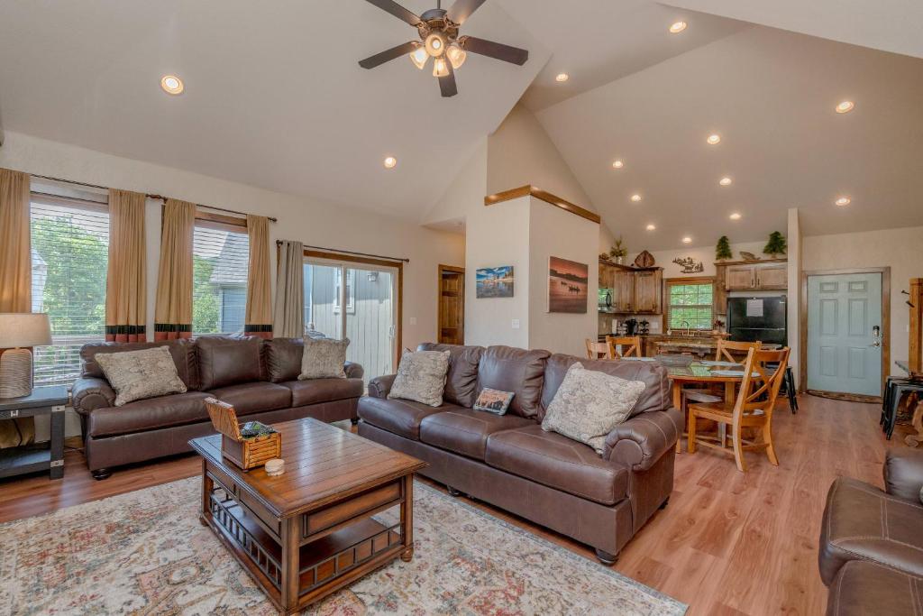a living room with a couch and a table at Hickory Hideaway with Communal Pool Access in Hollister