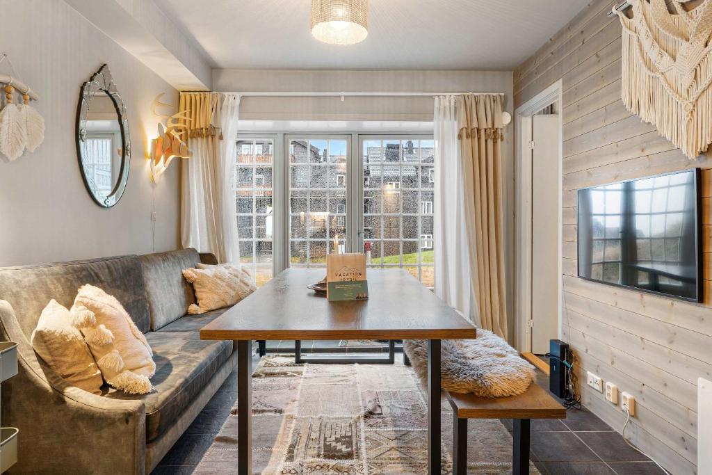 a living room with a couch and a table at TH963- Cozy Ski-in out apartment in Trysil in Trysil
