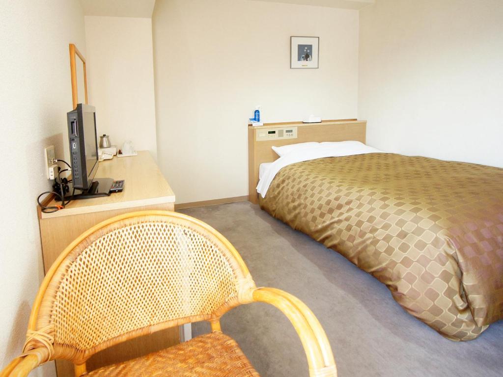 Postel nebo postele na pokoji v ubytování Hotel Trend Nagano