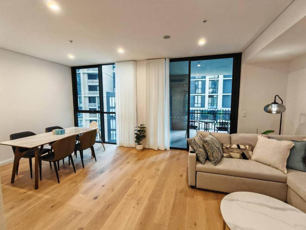 a living room with a couch and a table at Brand new 2BR APT in Castle Hill in Castle Hill