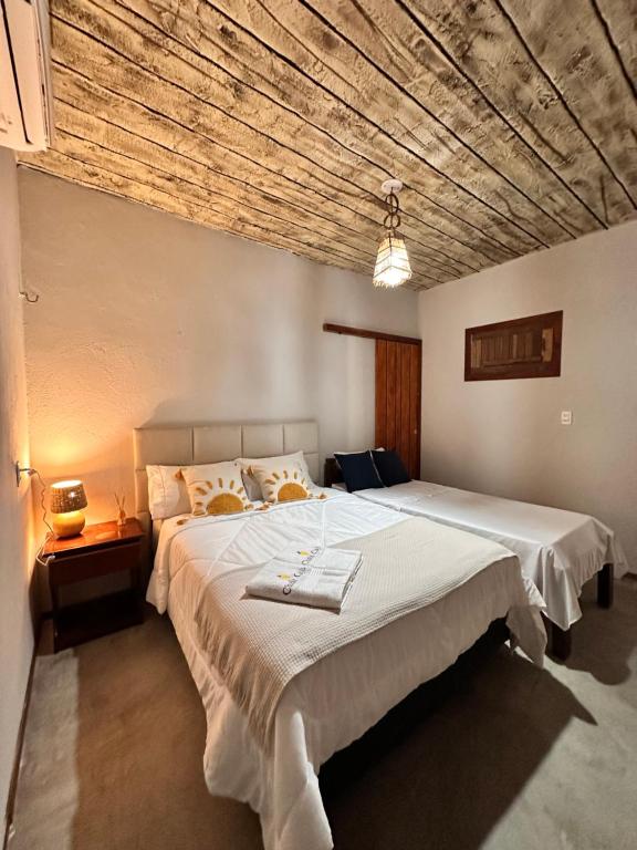 Ένα ή περισσότερα κρεβάτια σε δωμάτιο στο Chalé Caju