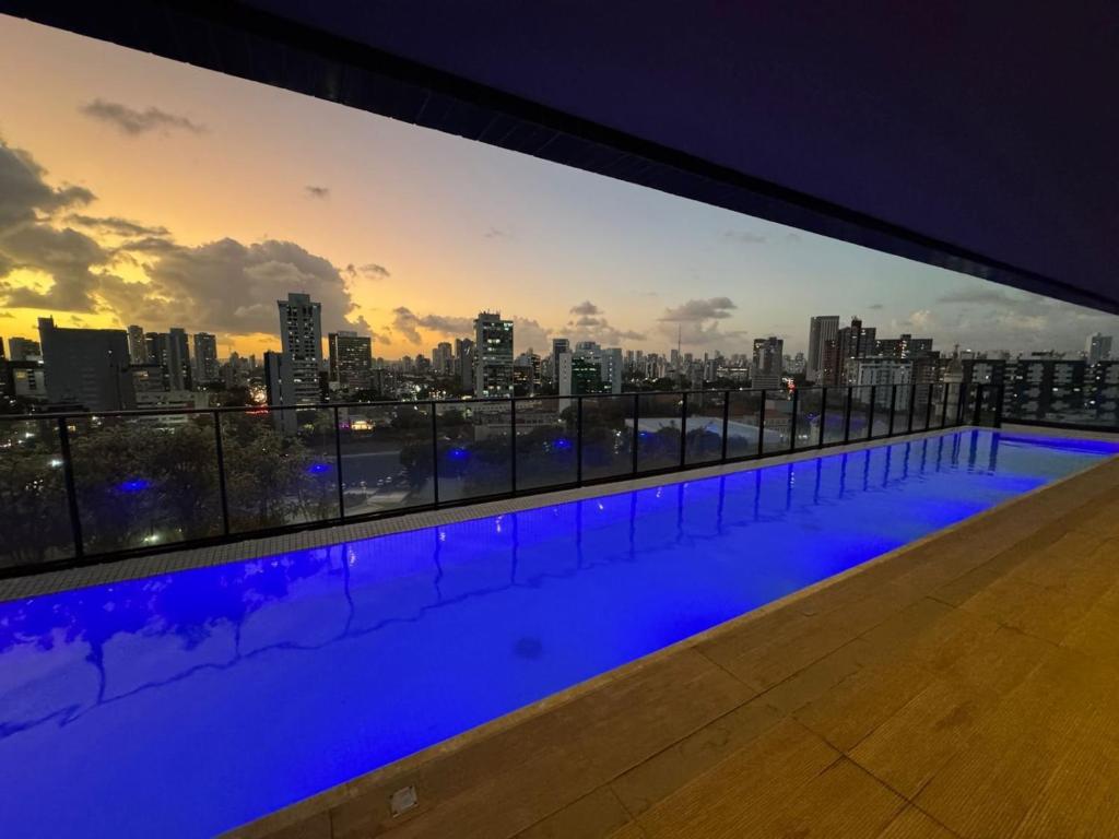 a swimming pool with a view of the city at Tolive One - Leite Island, Recife in Recife