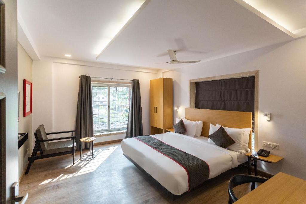 Ένα ή περισσότερα κρεβάτια σε δωμάτιο στο Super Townhouse Habitat New Town Rooms & Party Spaces