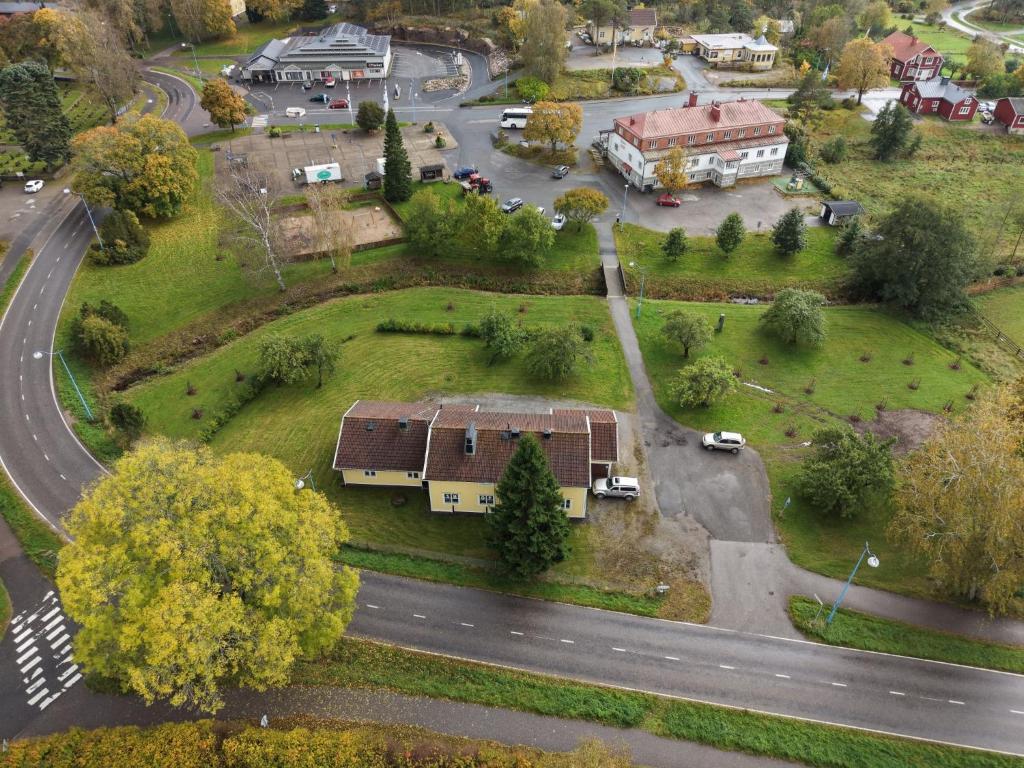 a model of a house with a yard and a road at Korpinpesä in Korppoo