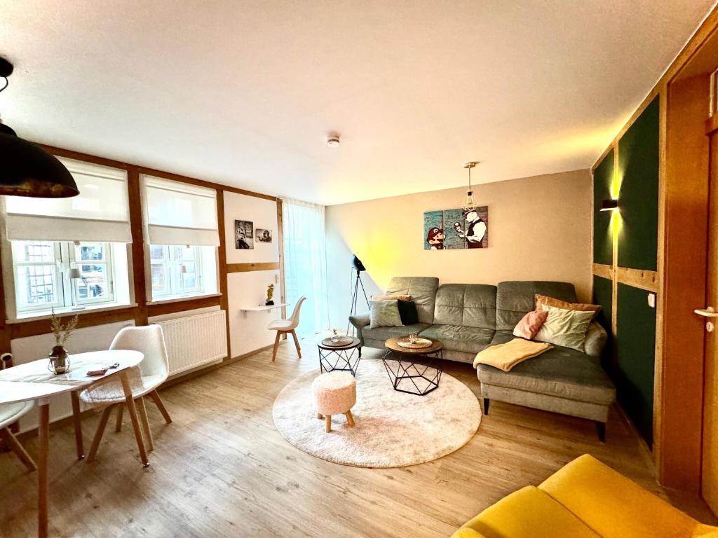 a living room with a couch and a table at Wohnung In Wolfenbüttel in Wolfenbüttel