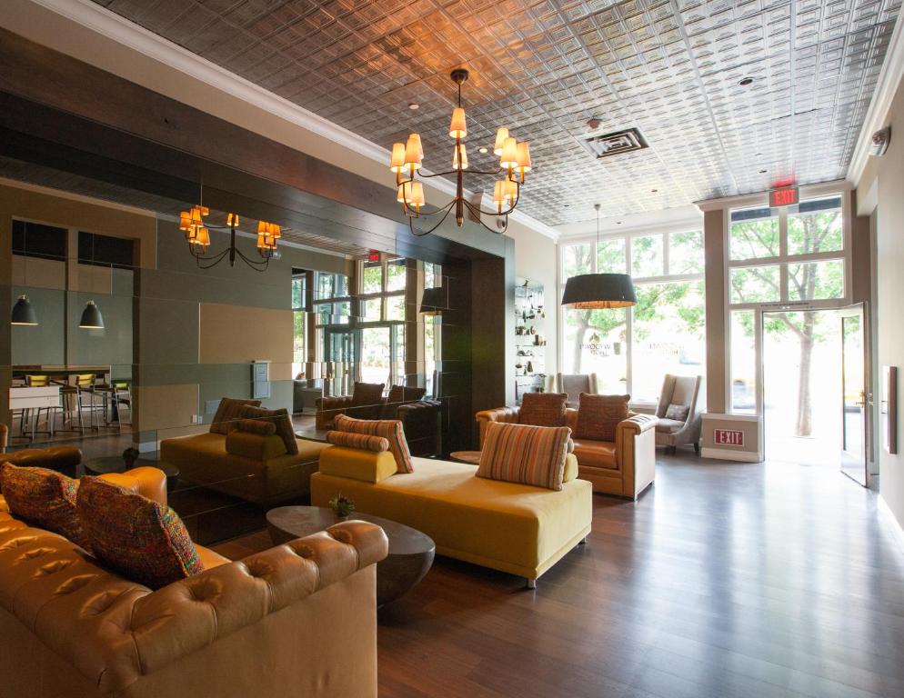 a large living room with couches and chairs at Wydown Hotel in St. Helena