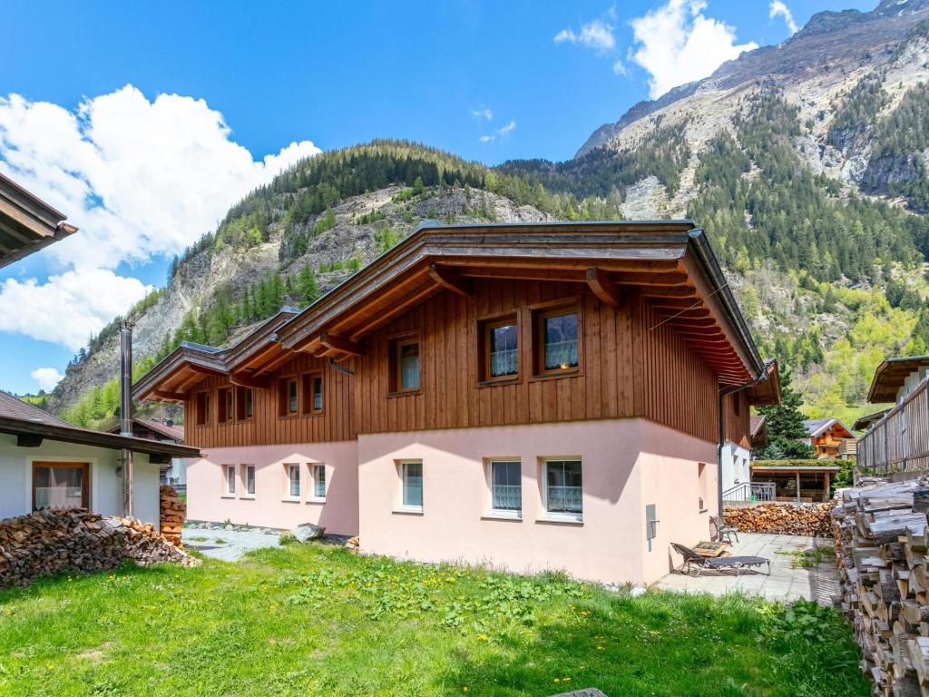 a house in front of a mountain at Haus Oliver 3 in Längenfeld
