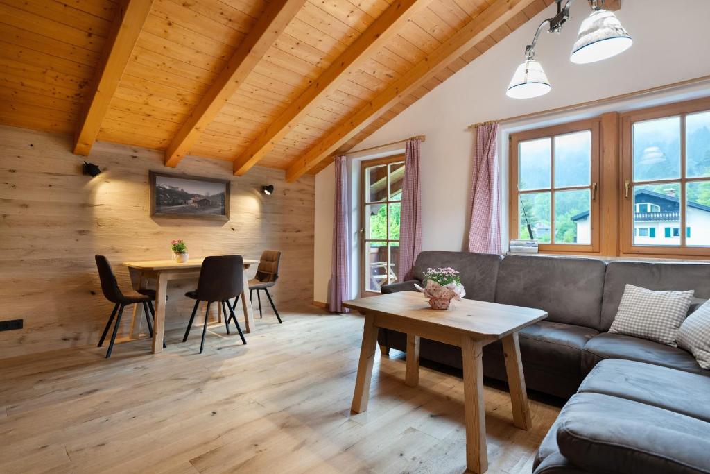 a living room with a couch and a table at Kramer in Garmisch-Partenkirchen