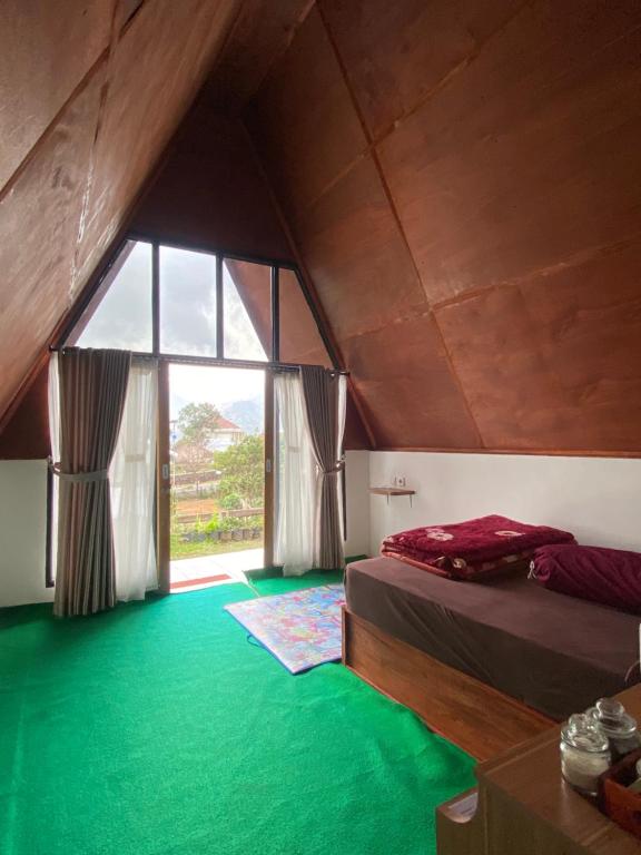 Ένα ή περισσότερα κρεβάτια σε δωμάτιο στο Roman Homestay syariah