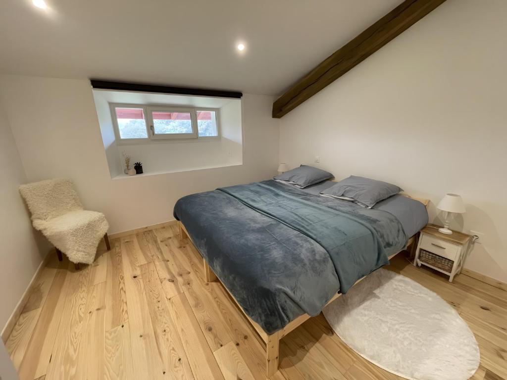 a bedroom with a large bed and a window at Gite Goitiaya in Luxe-Sumberraute