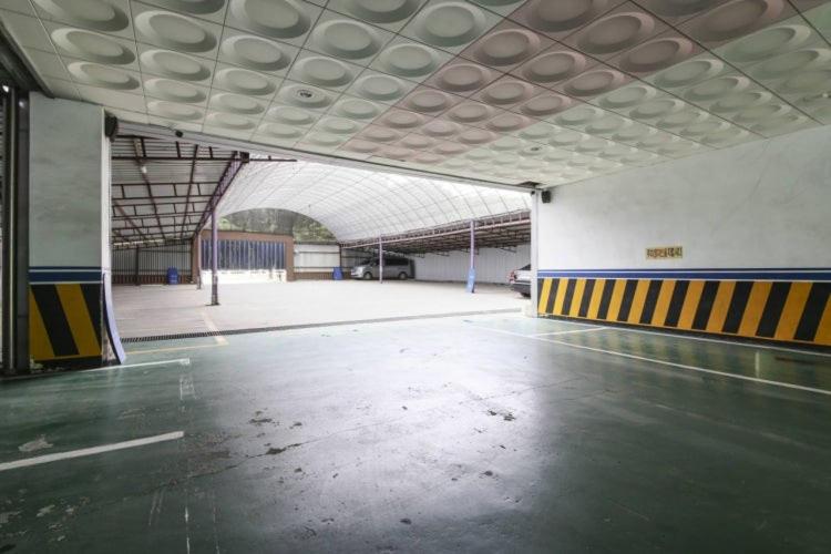 an empty parking garage with an empty parking lot at 전주 나비모텔 