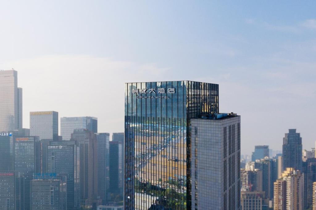 a tall building in the middle of a city at C Plaza Hotel in Chongqing