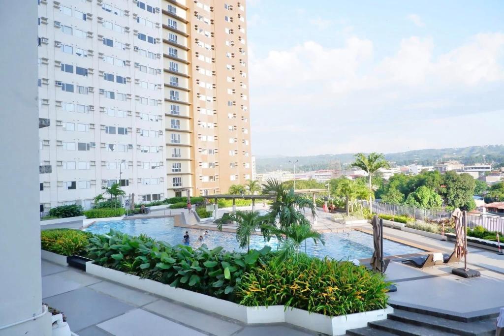 a view from the balcony of a building with a swimming pool at Urban Oasis in Cagayan de Oro City in Cagayan de Oro