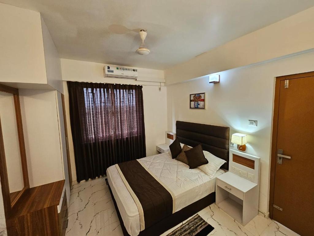 Ένα ή περισσότερα κρεβάτια σε δωμάτιο στο Krishna Sannidhi