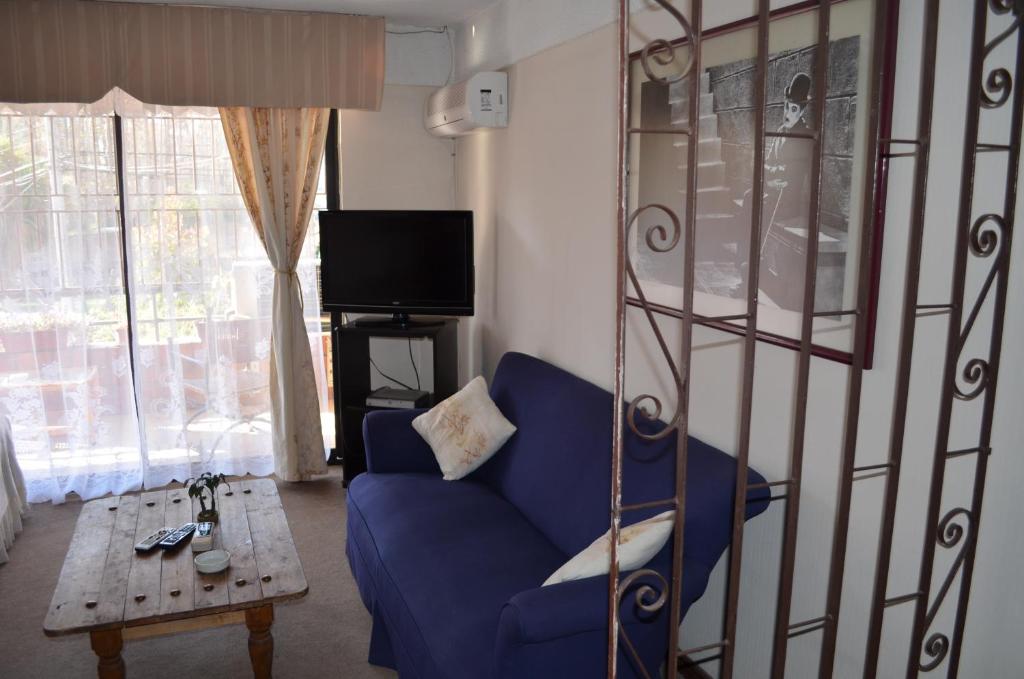 TV a/nebo společenská místnost v ubytování Apart Hotel Punto Real