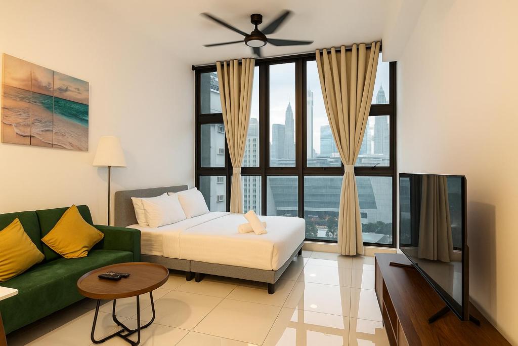 Ένα ή περισσότερα κρεβάτια σε δωμάτιο στο Majestic Imperial Suites KLCC