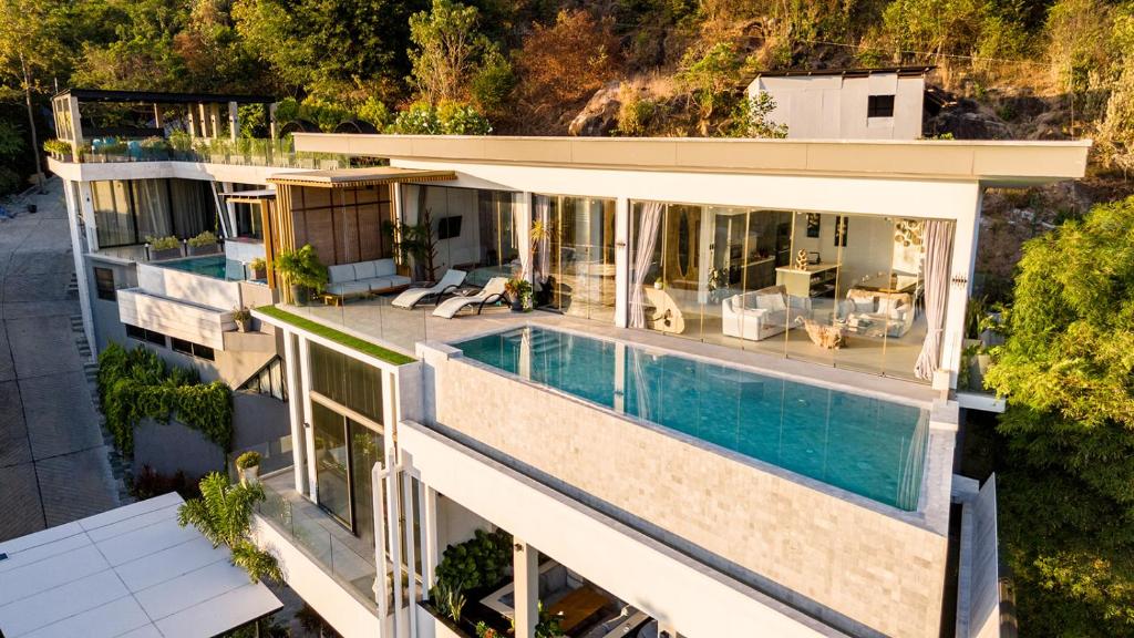 an aerial view of a house with a swimming pool at Magic suites Seaview villas, Koh Samui in Choeng Mon Beach