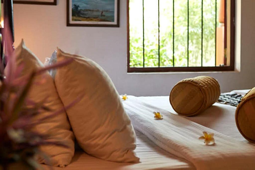 Postel nebo postele na pokoji v ubytování Villa Sunbird Negombo