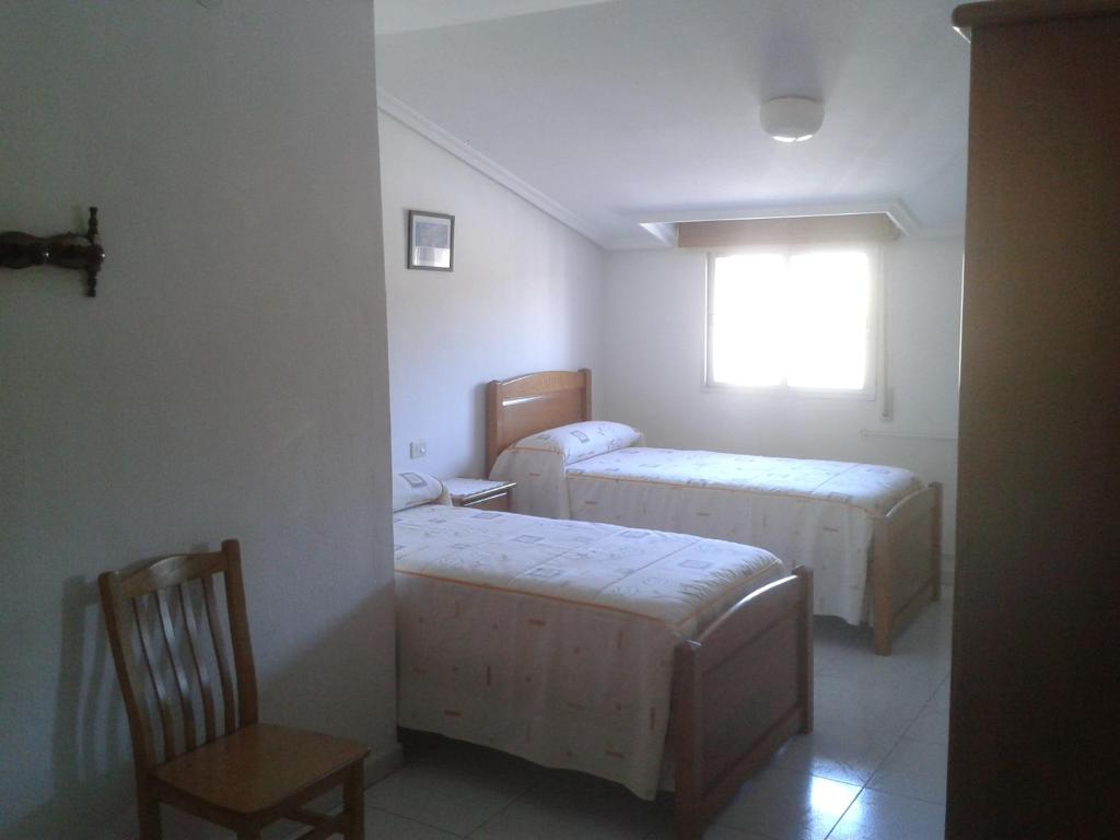 Postel nebo postele na pokoji v ubytování Hostal Sequeiros