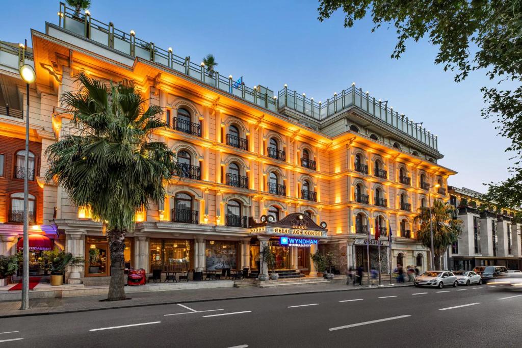 a lit up building on a city street at Wyndham Istanbul Old City in Istanbul