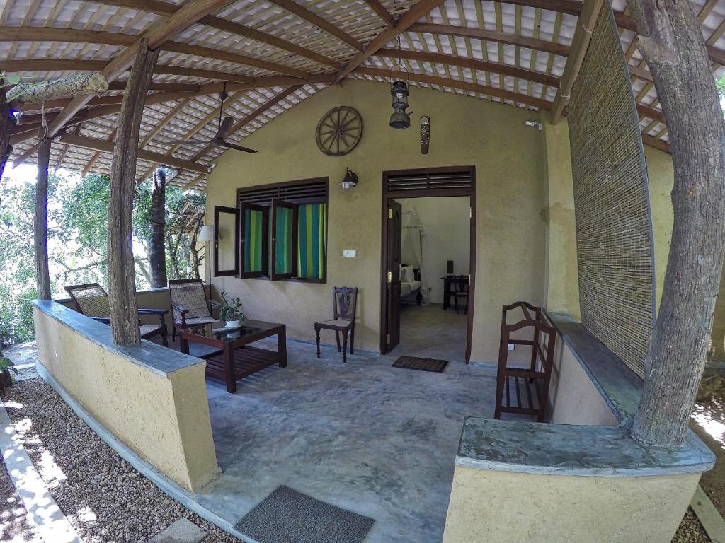 an outside view of a house with a patio at The Horizon Hill Top Villa in Unawatuna