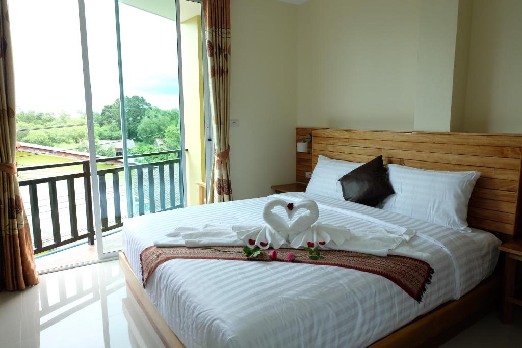 Postel nebo postele na pokoji v ubytování Chatin Guesthouse
