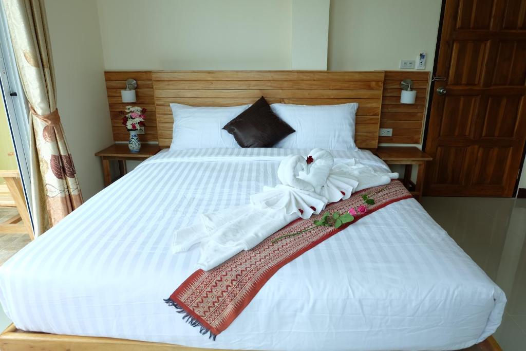Postel nebo postele na pokoji v ubytování Chatin Guesthouse