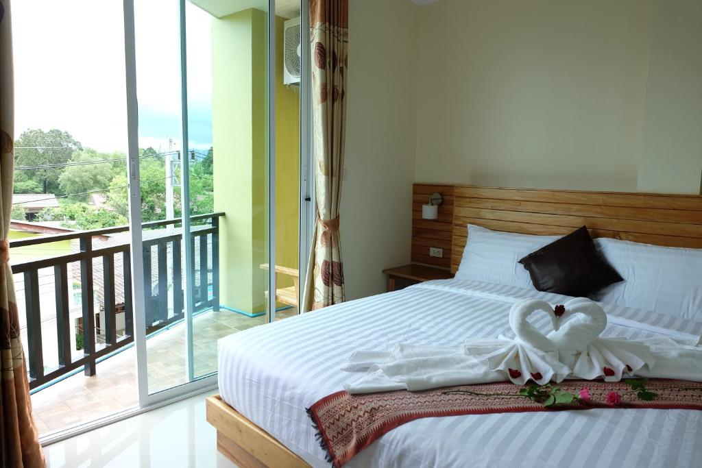 Postel nebo postele na pokoji v ubytování Chatin Guesthouse