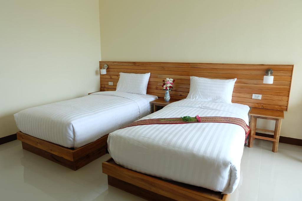 Postel nebo postele na pokoji v ubytování Chatin Guesthouse