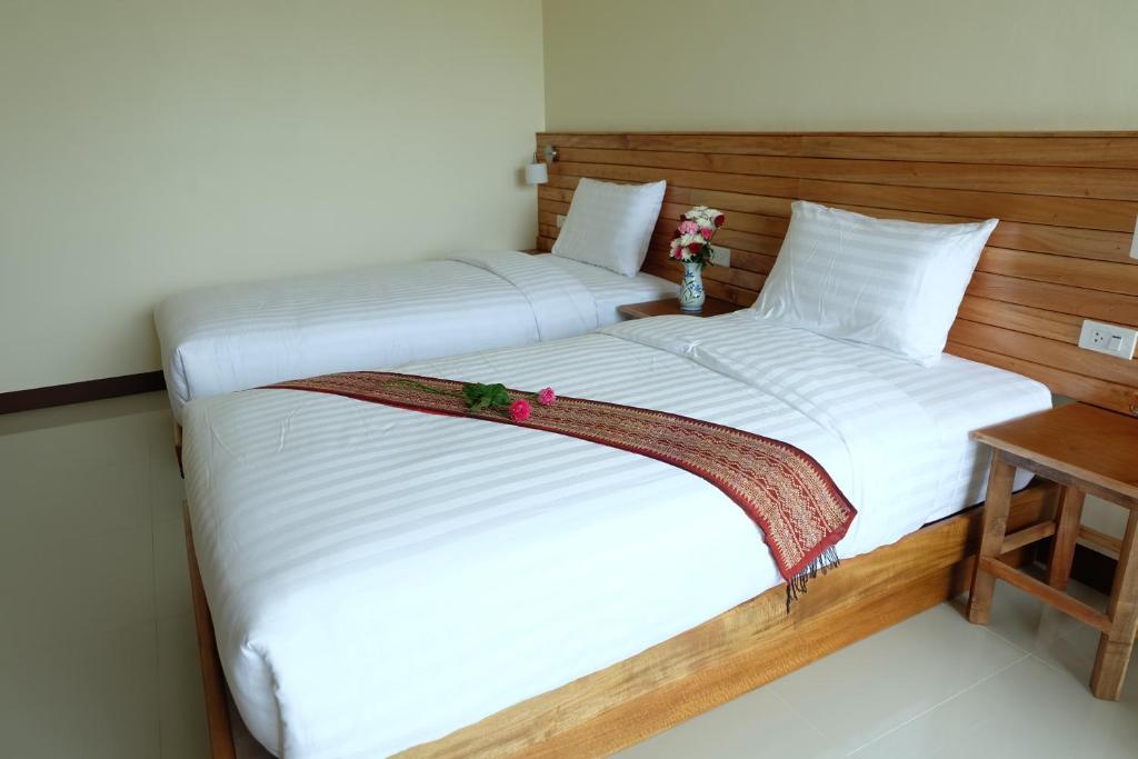 Postel nebo postele na pokoji v ubytování Chatin Guesthouse