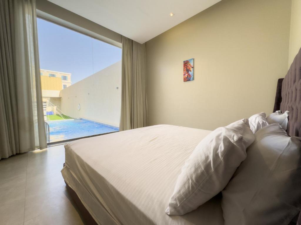 Ένα ή περισσότερα κρεβάτια σε δωμάτιο στο Passion 1 Al arid شاليه باشن حي العارض