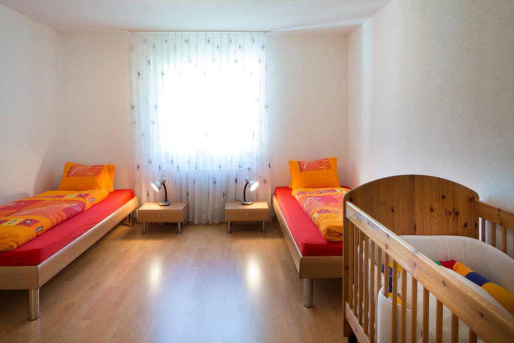 Postel nebo postele na pokoji v ubytování Hotel Sörenberg