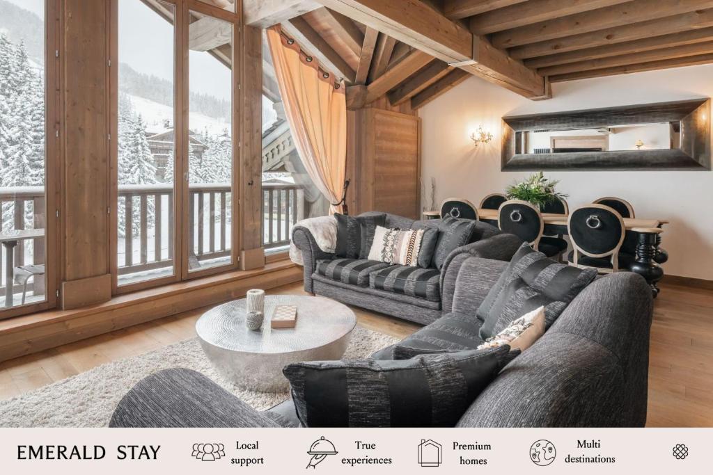 a living room with a couch and a table at Apartment Aelora Courchevel - by EMERALD STAY in Courchevel