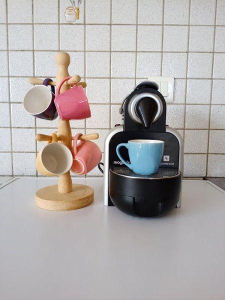 a kitchen counter with a coffee maker and a cup at Gîte de Goutrens in Goutrens