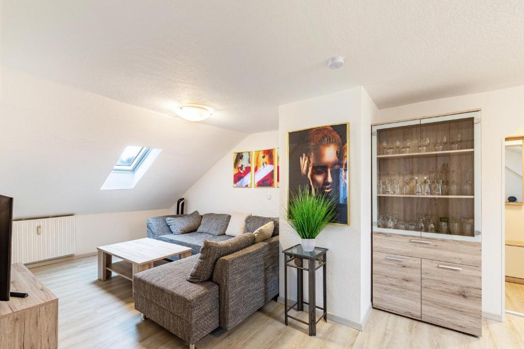 a living room with a couch and a table at Tapas Restaurante 2 in Viersen