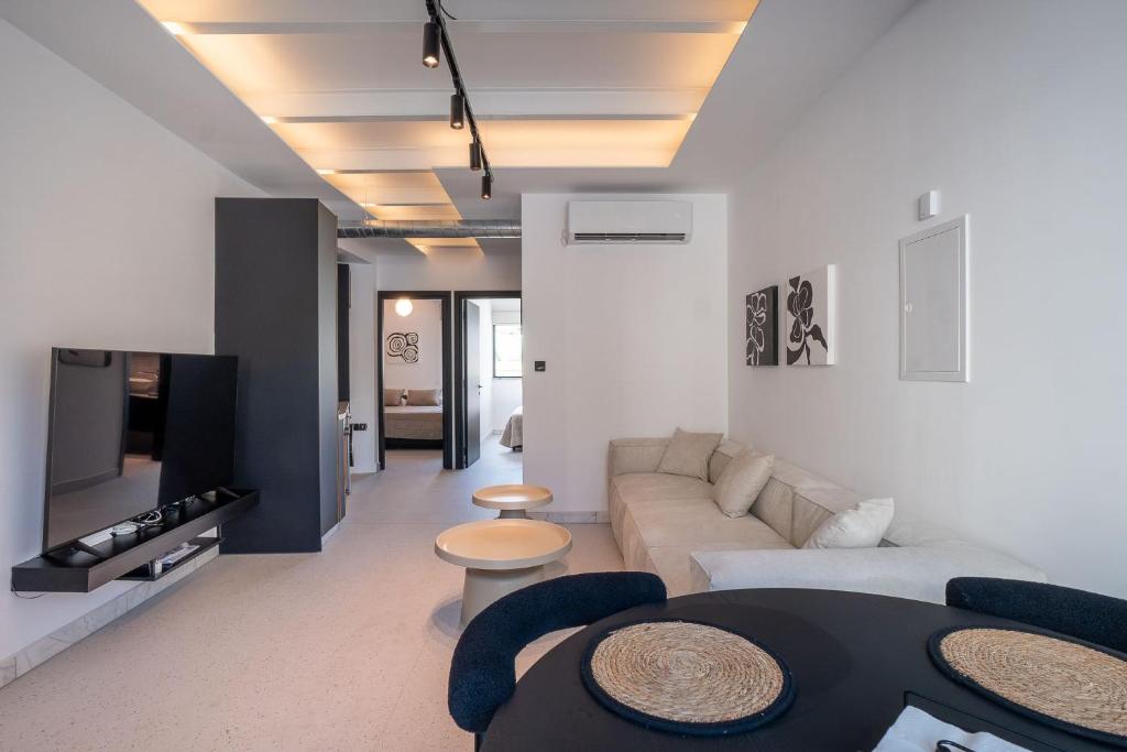 a living room with a couch and a table at Modern 2BR-Old Town Pafos in Paphos