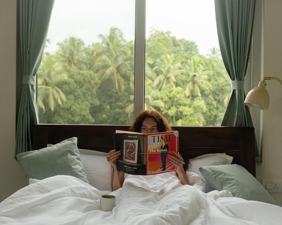 Ένα ή περισσότερα κρεβάτια σε δωμάτιο στο Bay Village Inn