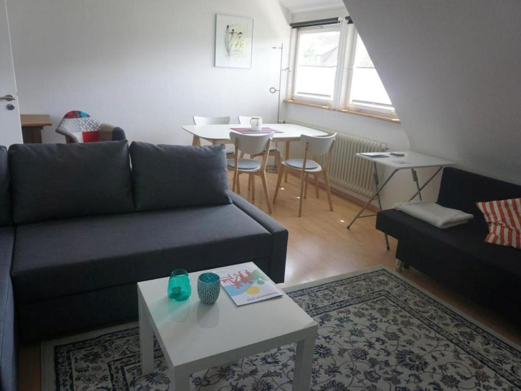 a living room with a couch and a table at Ferienwohnung Kirsch-kern in Mössingen
