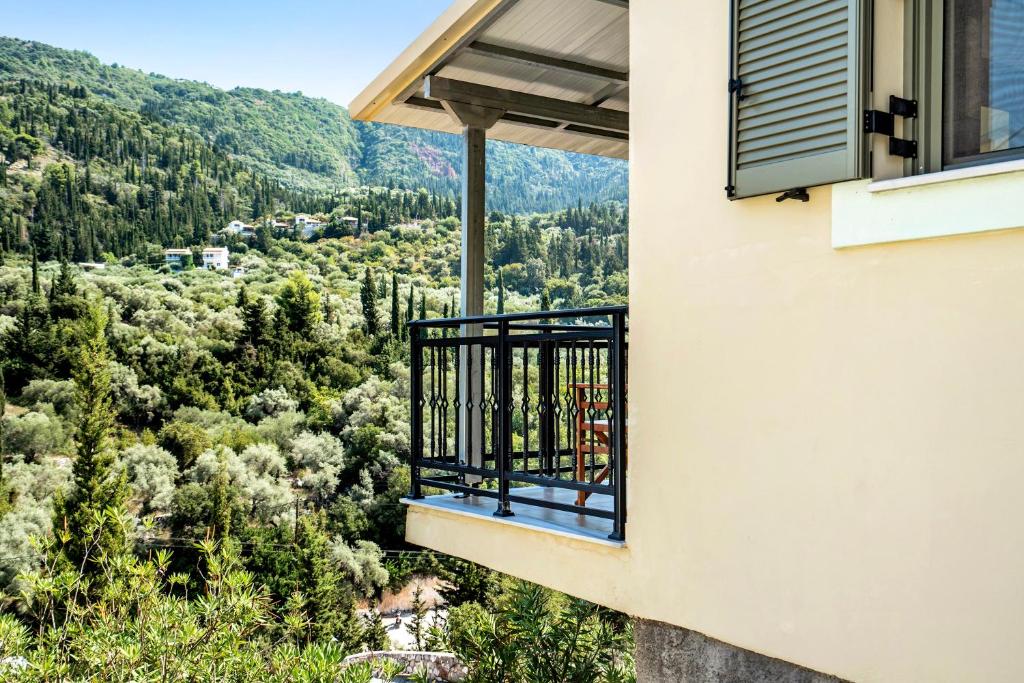 a balcony with a view of the mountains at Alkionides Apartment 3 in Agios Nikitas