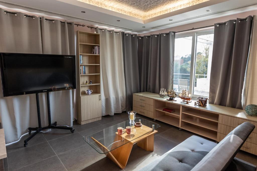 TV a/nebo společenská místnost v ubytování Michele Studio