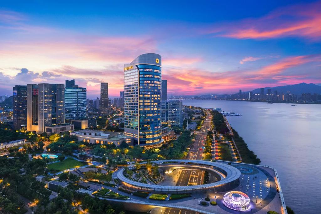 a view of a city at night with a river at Shangri-La Wenzhou in Wenzhou