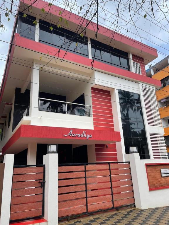 a house with a red and white at Reunion Aaradhya Villa in Udupi